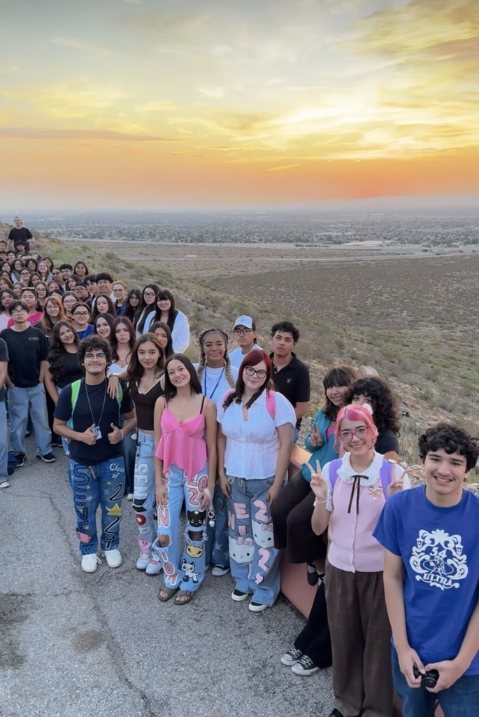 Transmountain Early College High School students take group photo at senior sunrise at scenic drive