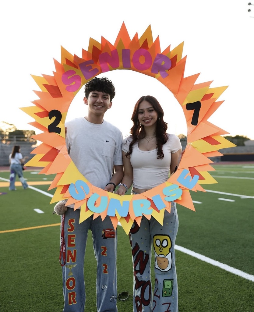 Burges High School students take photo with paper sun that says Senior 27 Sunrise