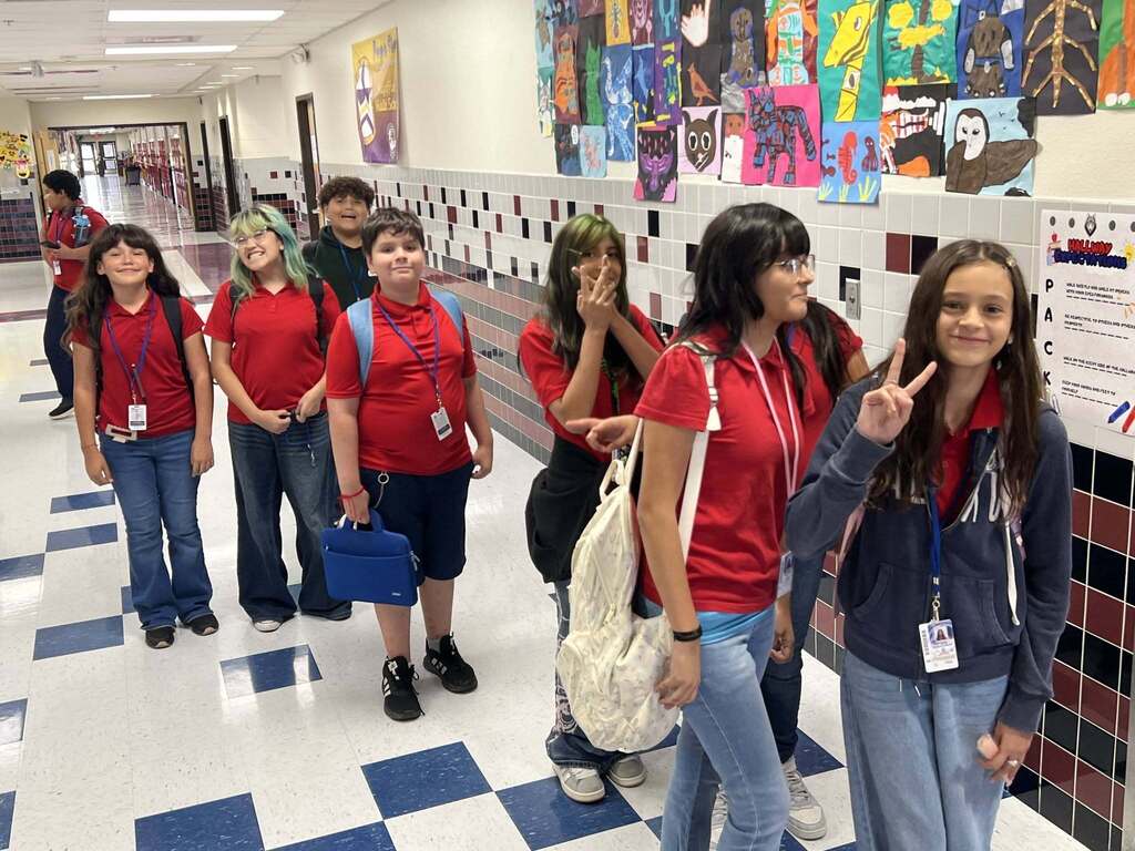 Magoffin Middle School 6th grade students wait in line to receive ice pops as incentive award for highest class attendance