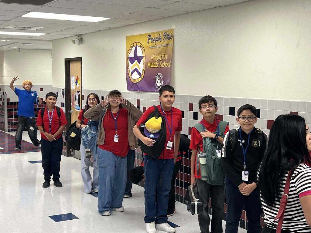 Magoffin Middle School 6th grade students wait in line to receive ice pops as incentive award for highest class attendance