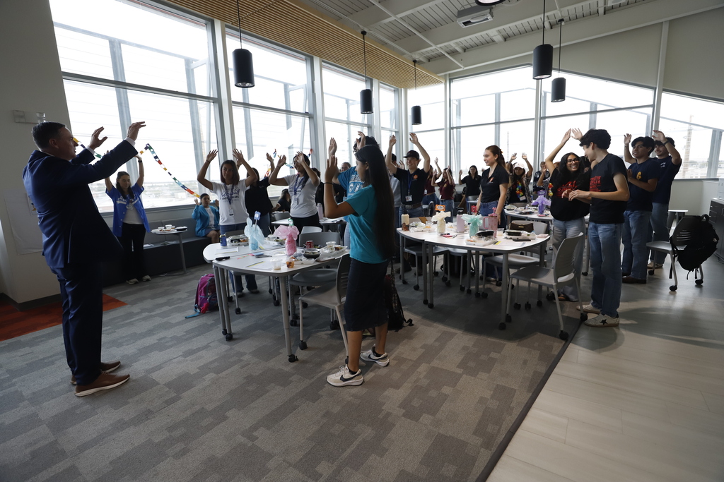 David Bates does fun exercise with students in the Superintendent Student Advisory Council