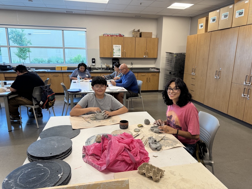 Photo of pottery Healthy Living class with two individuals smiling towards camera