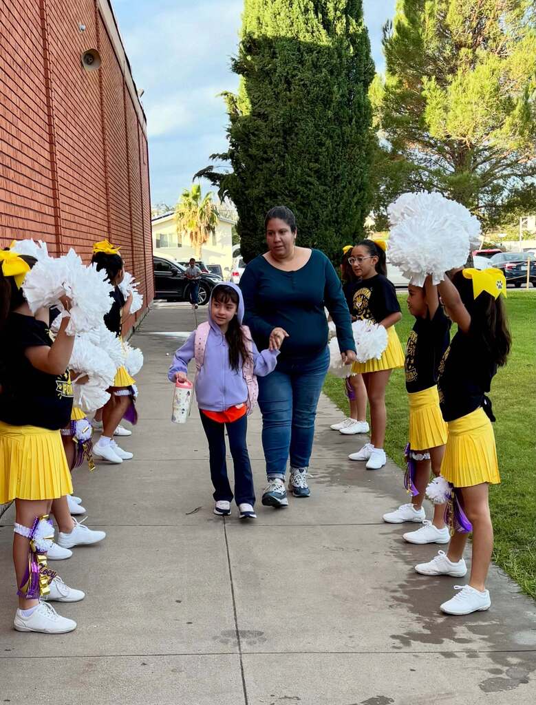 Cielo Vista Elementary School cheerleaders welcome student and parent into the campus