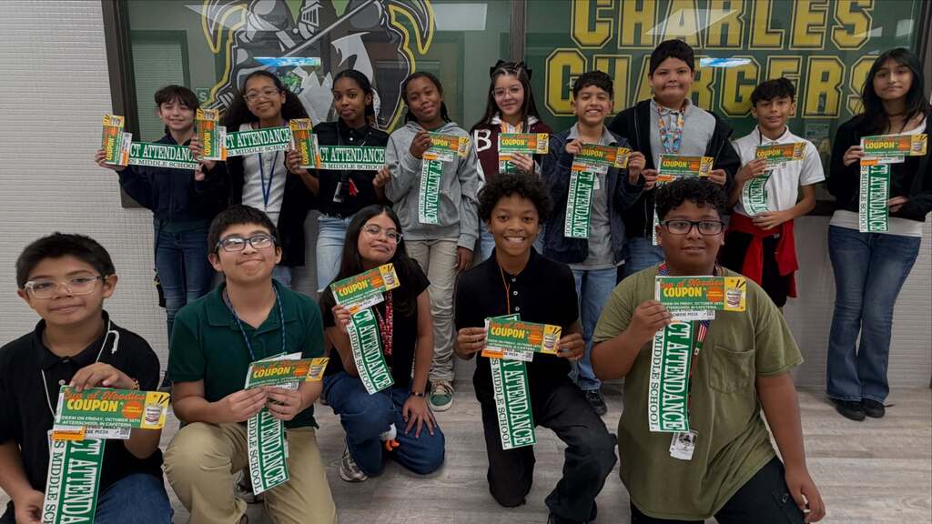 Students smile with their cup of noodles coupons