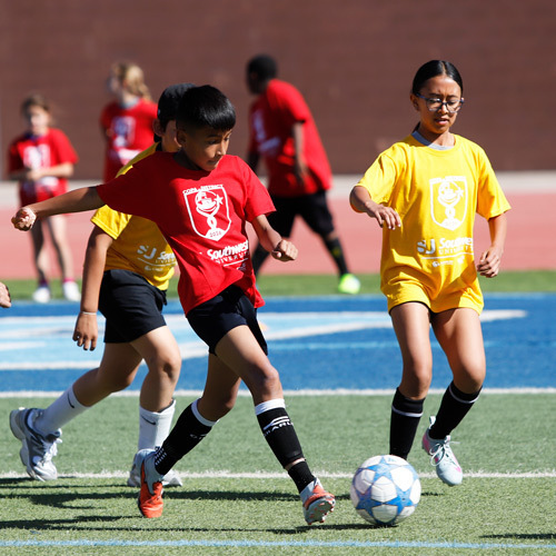 an image of kids playing soccer