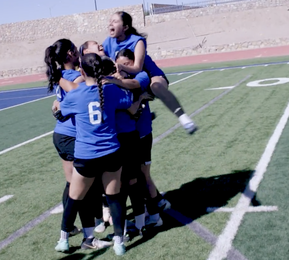 soccer players celebrate