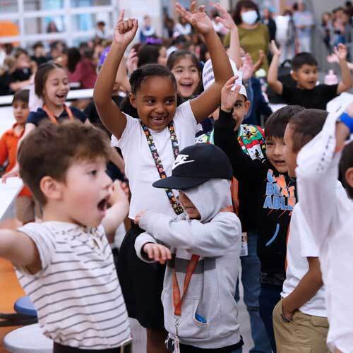students celebrate in a classroom