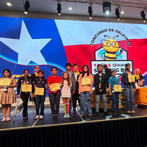 spelling bee participants on a stage
