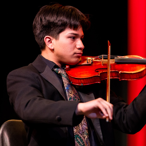 a student plays the violin