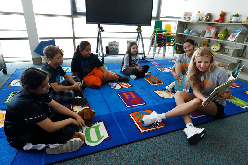 students read in a classroom