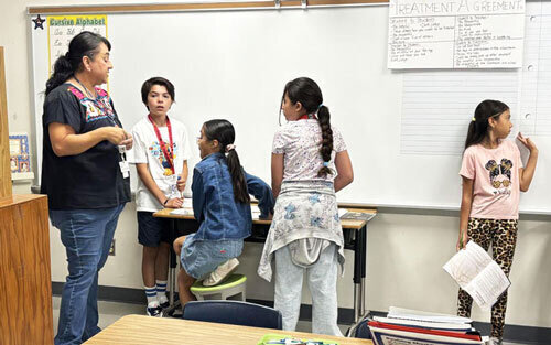 a teacher in her classroom