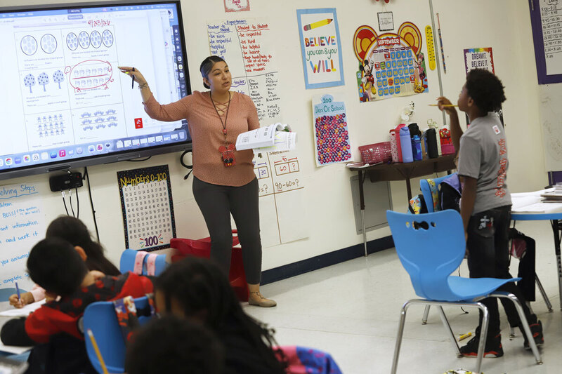 An image of a teacher in a classroom
