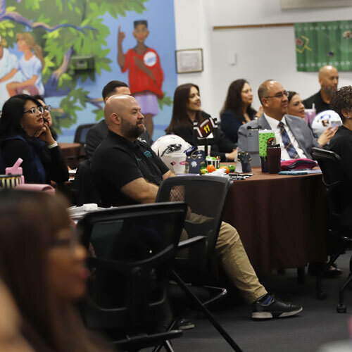 An image of principals in a large room