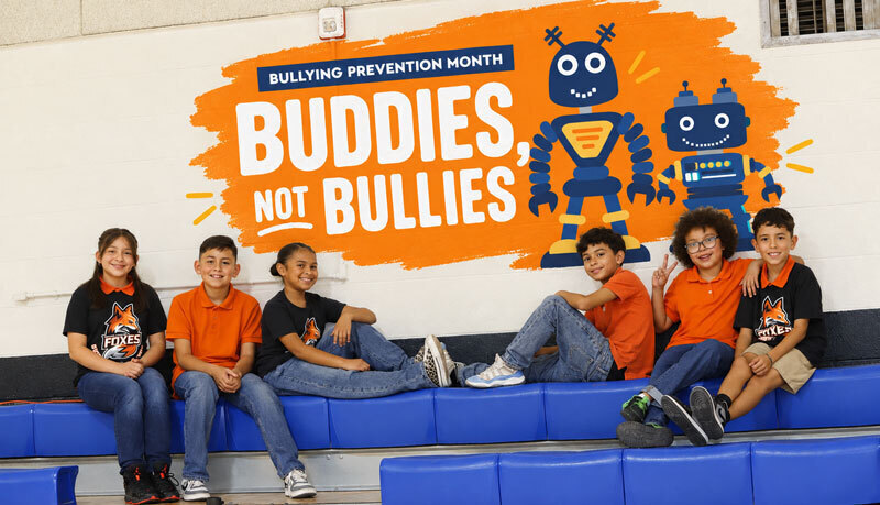 Students gather in a gym