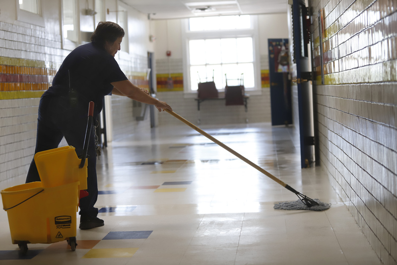 Custodial teams work together to cleanup after rainfall