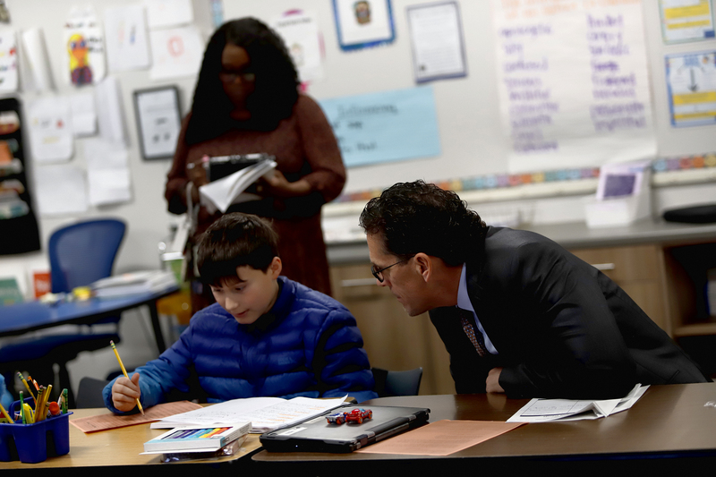 El Paso ISD Superintendent Dr. Brian Lusk and a student engaged in rigorous academic pursuits.