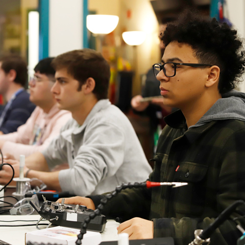 Sstudents work on drones