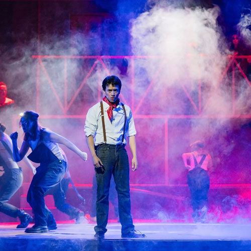 A student performs on a stage