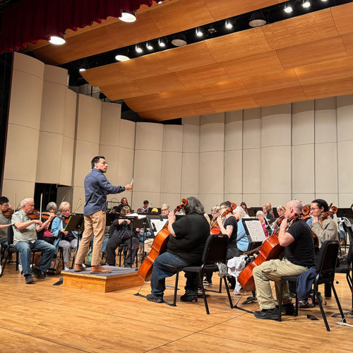 A teacher conducts a symphony