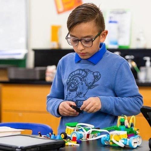 a student working on a project in a classroom