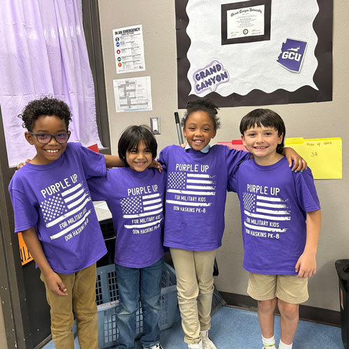 students stand in an office