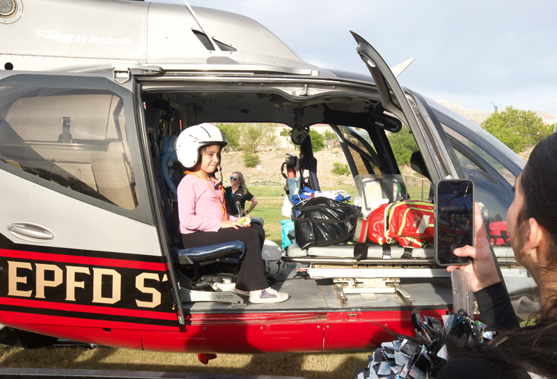 a student sits in a helicopter