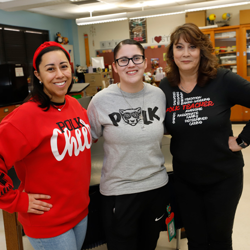 Teachers pose for a photo