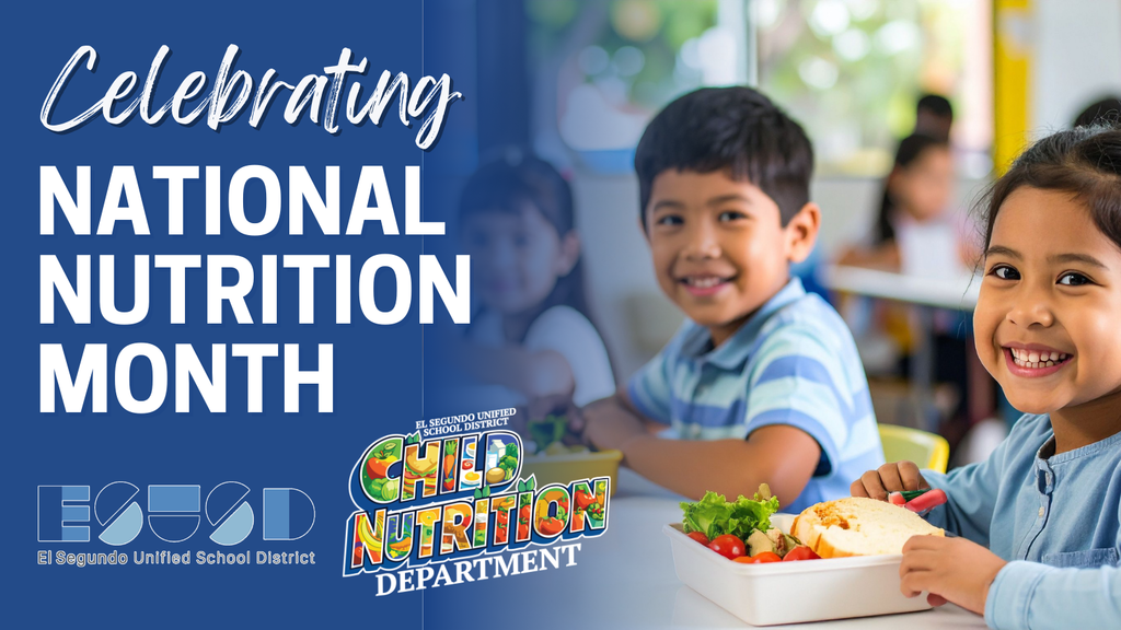 Two children sitting at a school cafeteria table with trays of healthy food, celebrating National Nutrition Month.