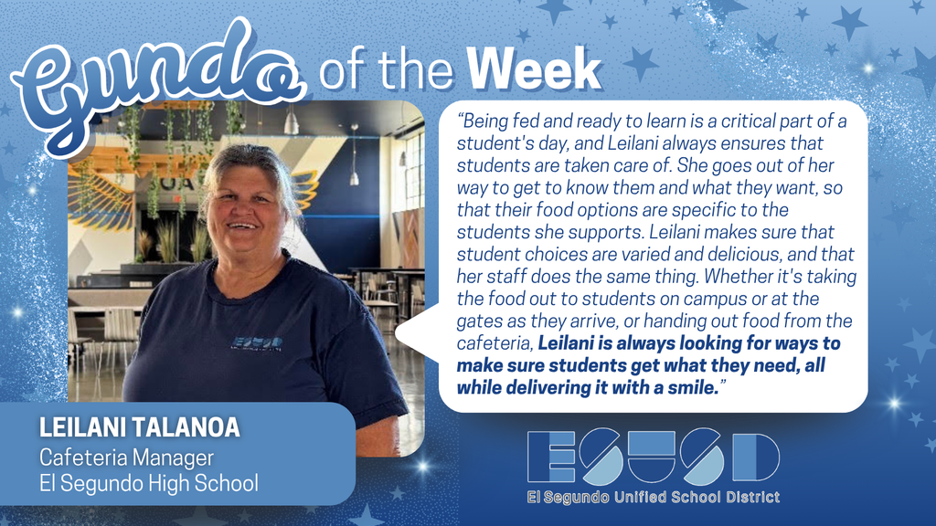Cafeteria manager Leilani Talanoa stands in a school kitchen, smiling confidently in front of food service equipment.