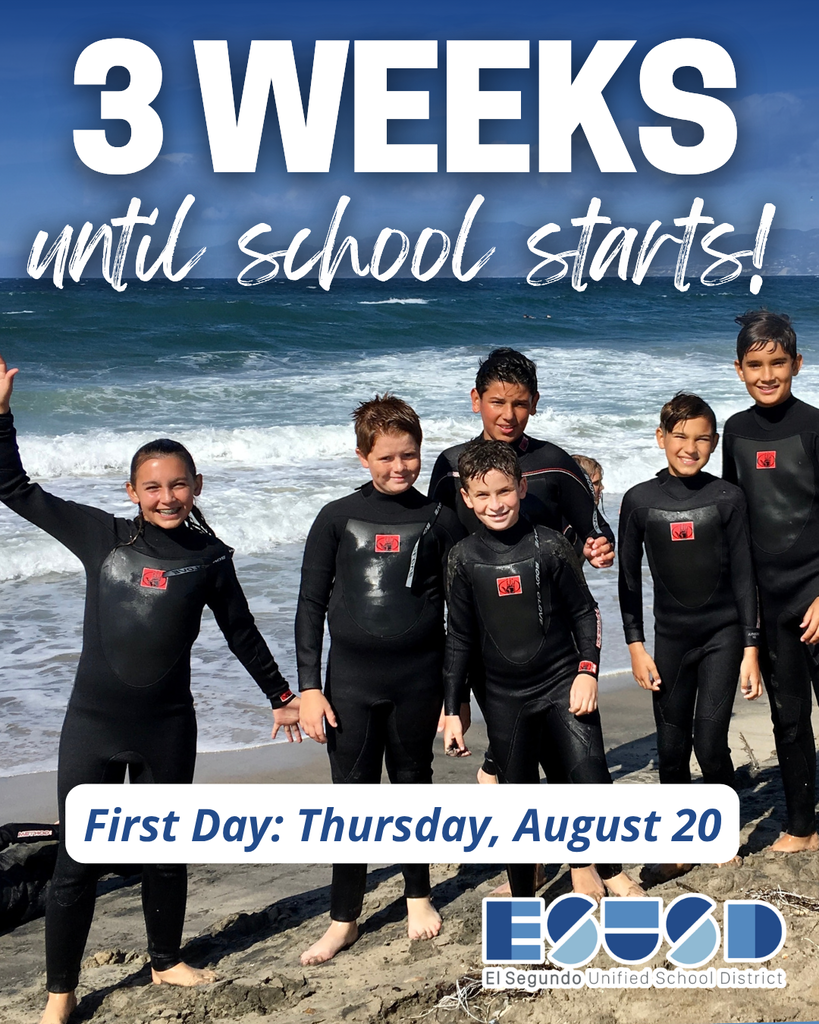 Six kids in wetsuits standing on a beach with waves behind them, smiling and ready for school starting in three weeks.