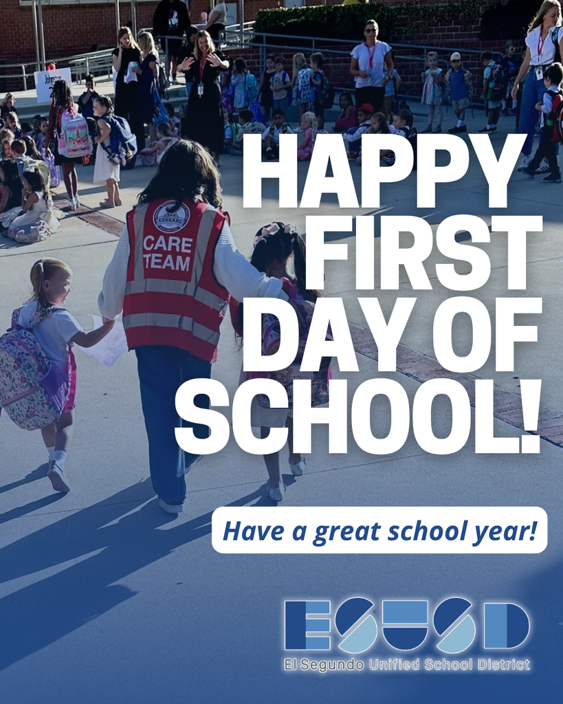 A CARE TEAM member holding hands with young students walking into school on the first day, surrounded by families and staff.