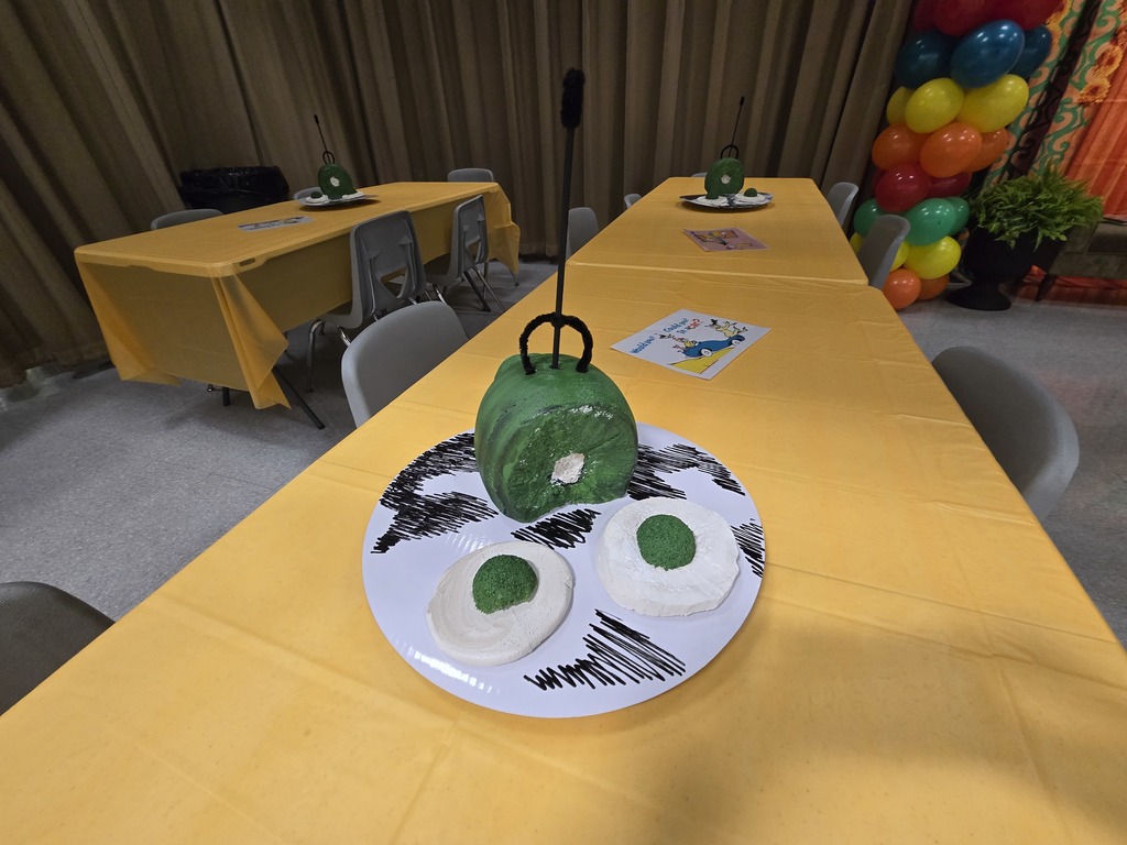 A table with a yellow tablecloth.