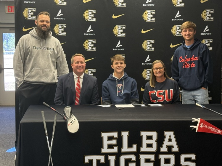A group of people sitting at a table.