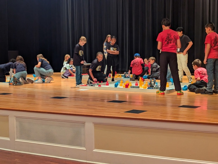 A group of kids on a stage.