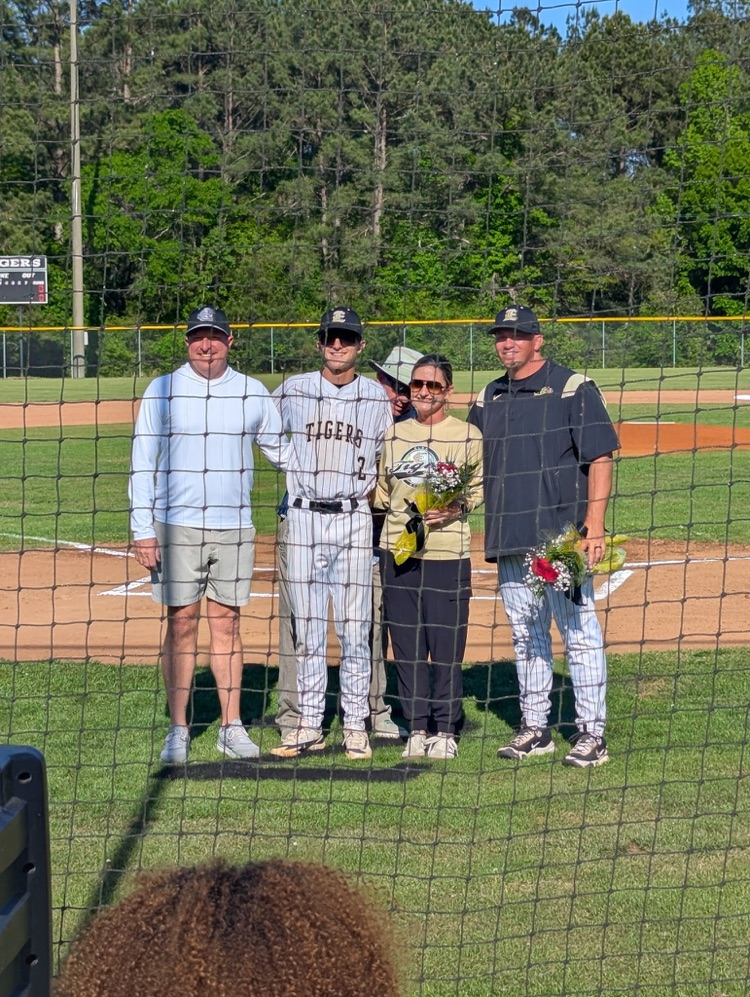 A family posing for a picture .