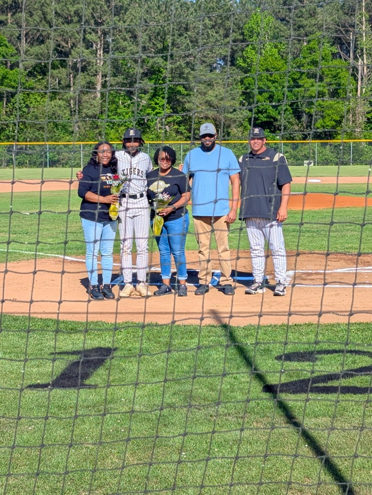 A family posing for a picture .