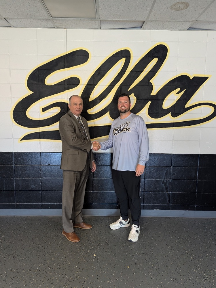 Two men shaking hands.