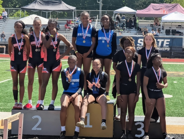 A group of kids on a podium.