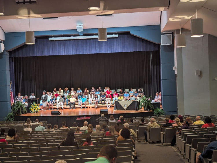 A group of kids on a stage.