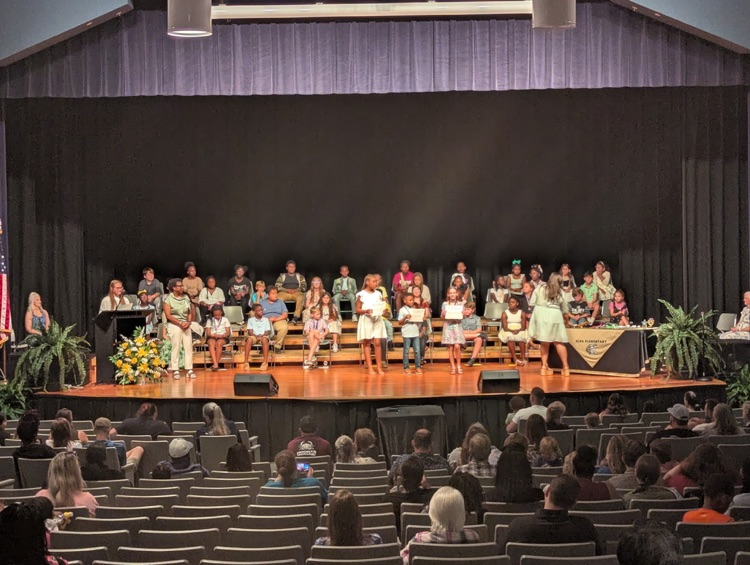 A group of people on a stage.