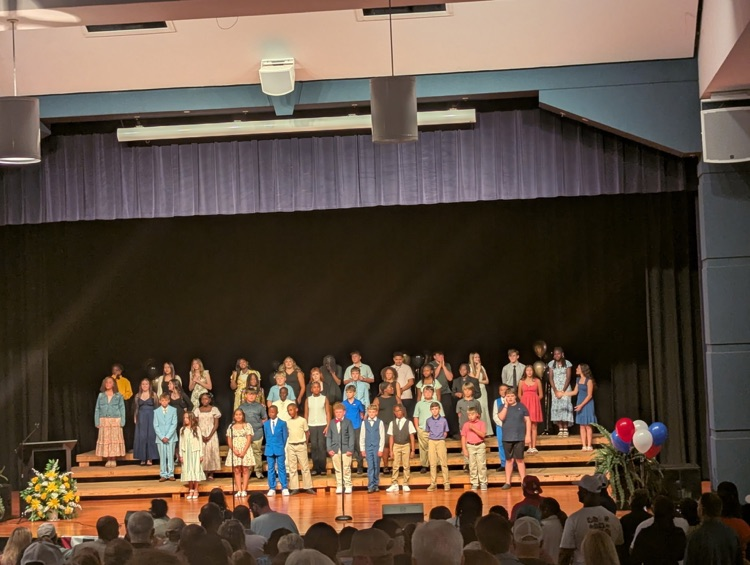 A group of kids onstage
