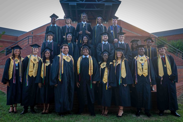 A Group of Graduates in their Cap and Gown.