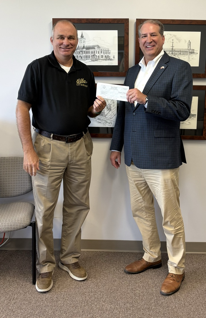 Two men holding a check.