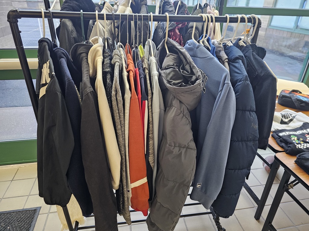 Image of lost & found clothes hanging on hangers