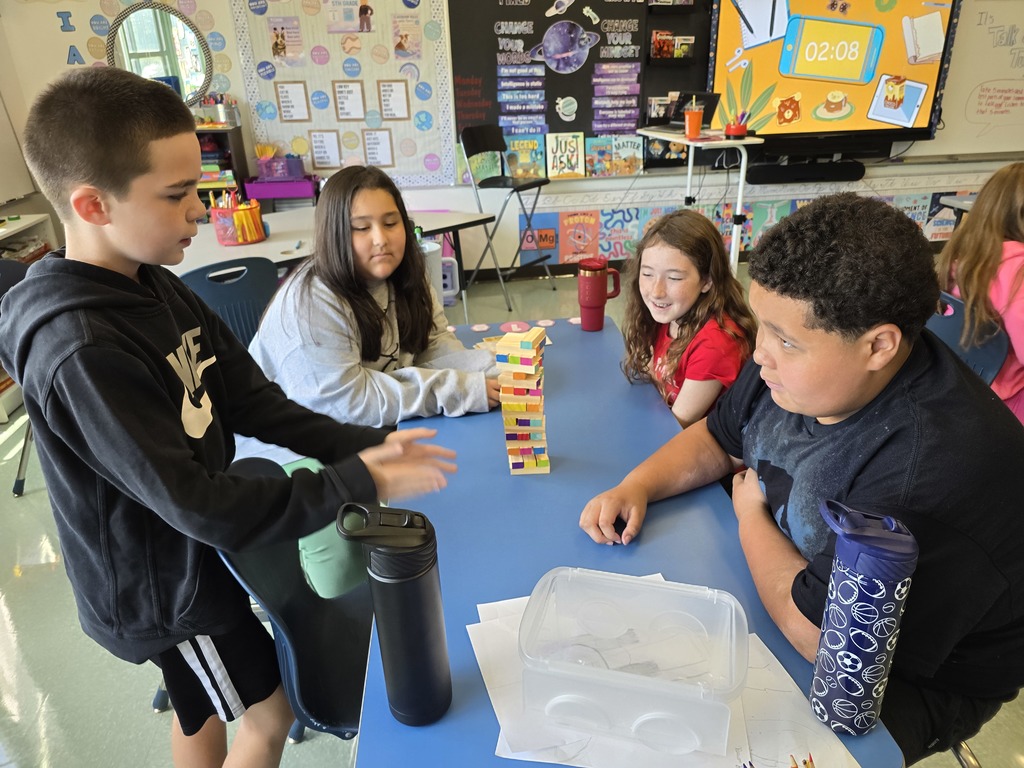 Students in 5th grade participate in a getting to know you activity center