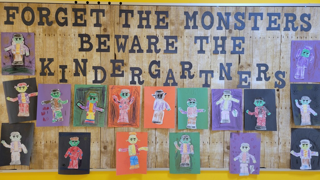 Bulletin board that says "forget the monsters beware the kindergartners" with images of Frankenstein's monster