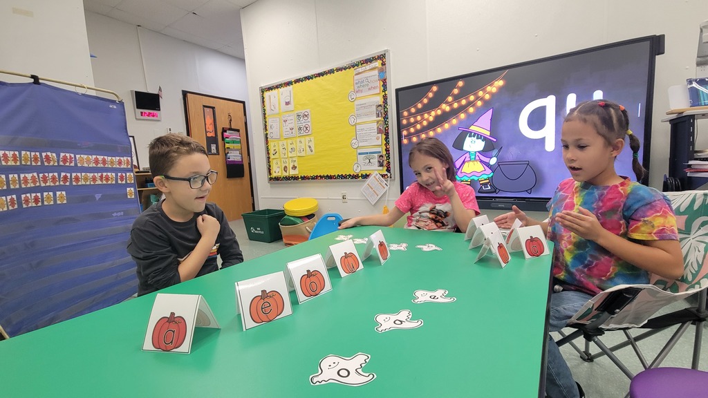 image of students playing a word game with a ghost & pumpkin theme