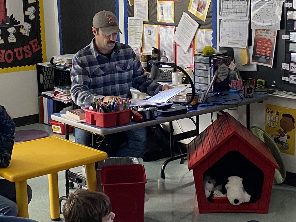 Parent Mystery Reader in 4th grade displaying a book under a document camera