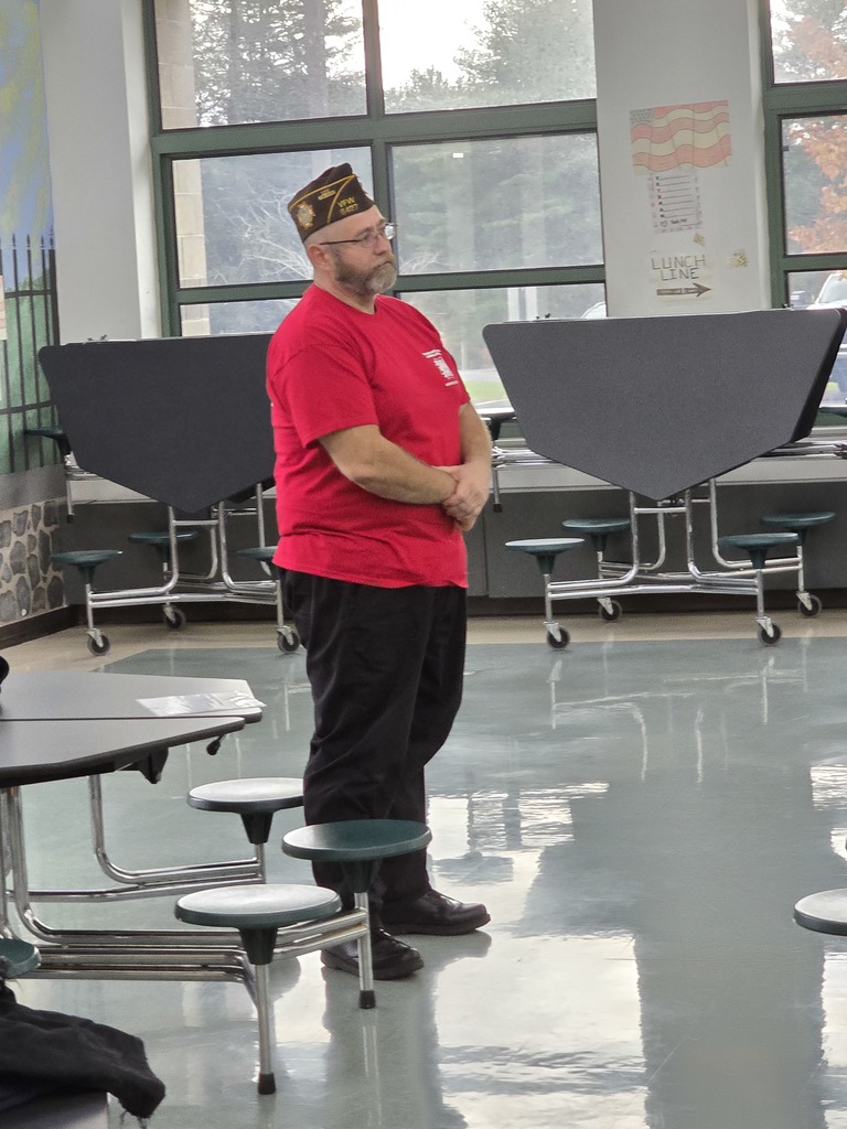 Image of a veteran standing at a veterans event
