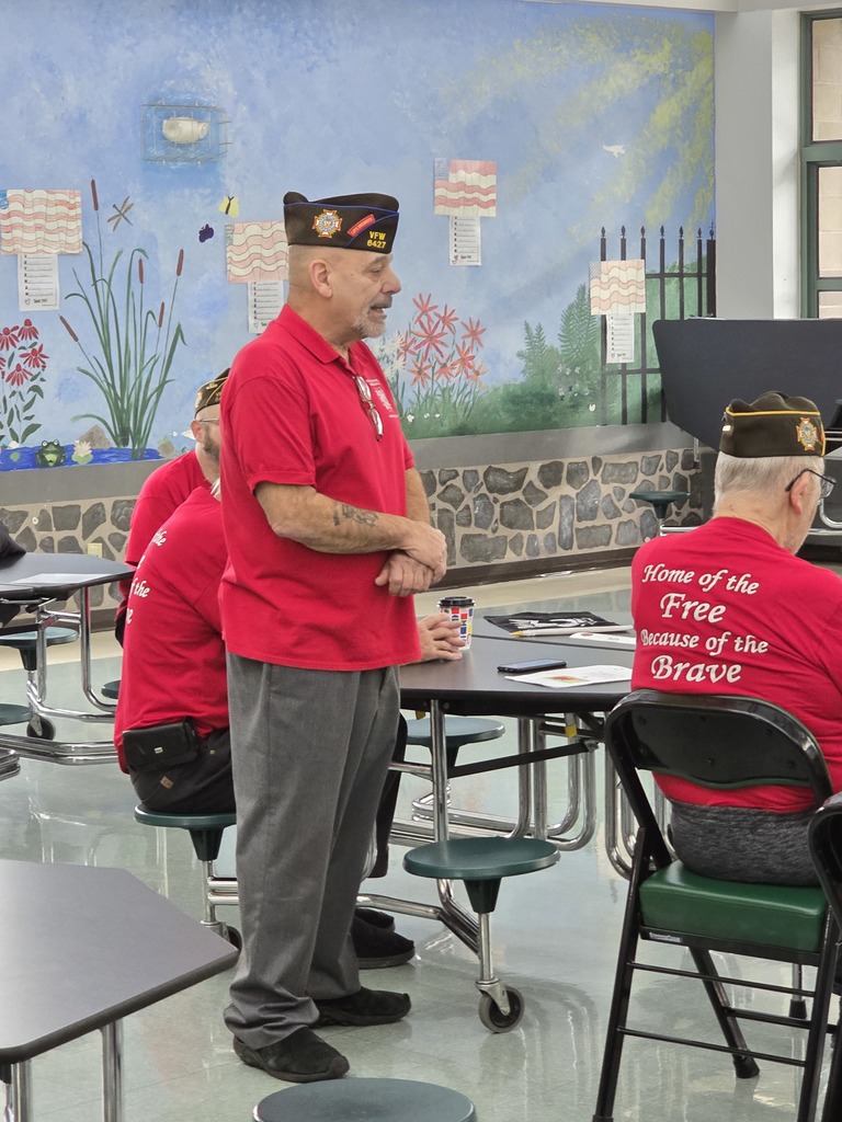 Image of a veteran from the local community speaking at a Veterans Day event